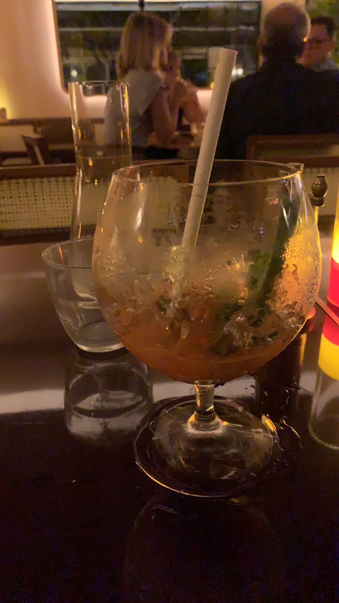 Almost empty goblet style glass of Bloody Mary